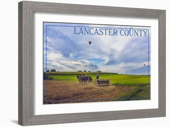 Lancaster County, Pennsylvania - Amish Farmer and Hot Air Balloons-Lantern Press-Framed Art Print