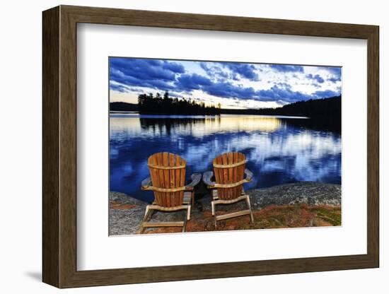 Landscape with Adirondack Chairs on Shore of Relaxing Lake at Sunset in Algonquin Park, Canada-elenathewise-Framed Photographic Print