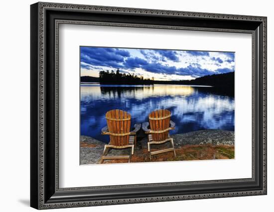 Landscape with Adirondack Chairs on Shore of Relaxing Lake at Sunset in Algonquin Park, Canada-elenathewise-Framed Photographic Print