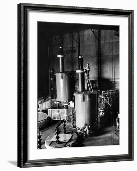 Large Cylinders, One W Man on Top Climbing Ladder at Westinghouse Plant-Alfred Eisenstaedt-Framed Premium Photographic Print