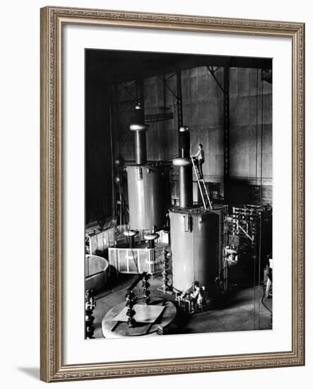 Large Cylinders, One W Man on Top Climbing Ladder at Westinghouse Plant-Alfred Eisenstaedt-Framed Premium Photographic Print