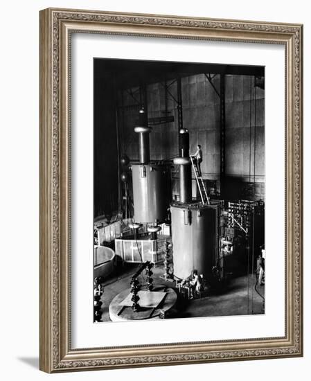 Large Cylinders, One W Man on Top Climbing Ladder at Westinghouse Plant-Alfred Eisenstaedt-Framed Photographic Print