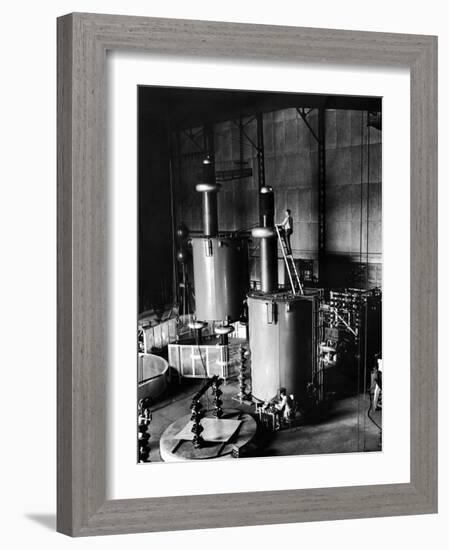Large Cylinders, One W Man on Top Climbing Ladder at Westinghouse Plant-Alfred Eisenstaedt-Framed Photographic Print