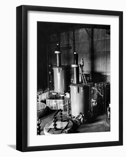 Large Cylinders, One W Man on Top Climbing Ladder at Westinghouse Plant-Alfred Eisenstaedt-Framed Photographic Print