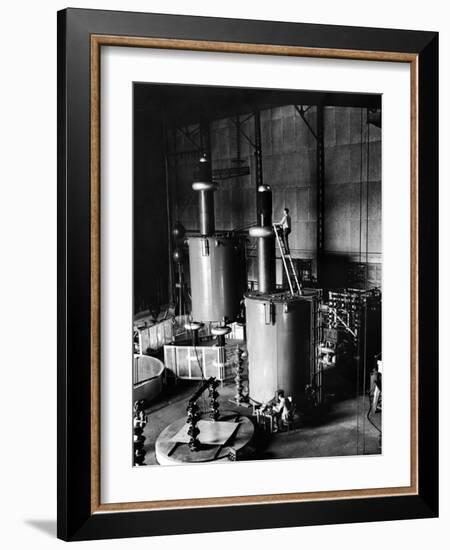 Large Cylinders, One W Man on Top Climbing Ladder at Westinghouse Plant-Alfred Eisenstaedt-Framed Photographic Print