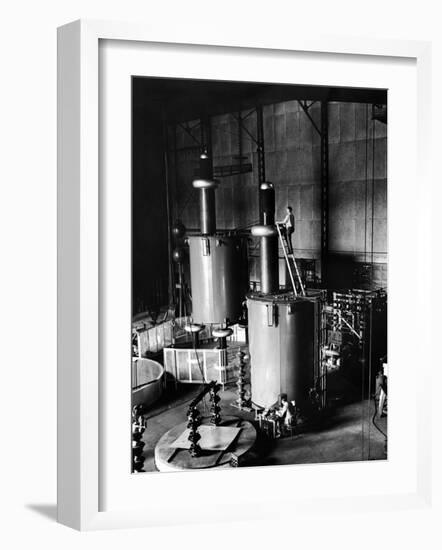 Large Cylinders, One W Man on Top Climbing Ladder at Westinghouse Plant-Alfred Eisenstaedt-Framed Photographic Print