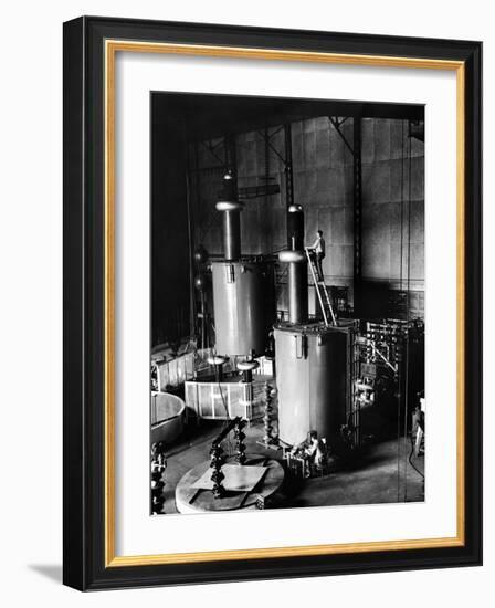 Large Cylinders, One W Man on Top Climbing Ladder at Westinghouse Plant-Alfred Eisenstaedt-Framed Photographic Print