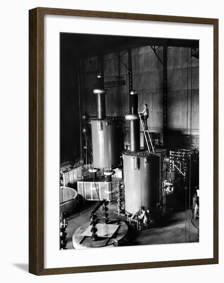 Large Cylinders, One W Man on Top Climbing Ladder at Westinghouse Plant-Alfred Eisenstaedt-Framed Photographic Print