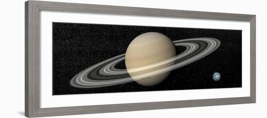 Large Planet Saturn and its Rings Next to Small Planet Earth-null-Framed Art Print