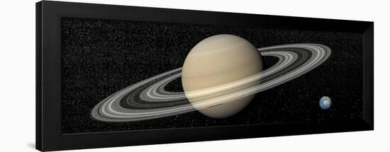 Large Planet Saturn and its Rings Next to Small Planet Earth-null-Framed Art Print