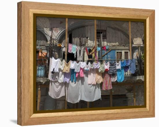 Large Quantity of Laundry Hanging from the Balcony of a Crumbling Building, Habana Vieja, Cuba-Eitan Simanor-Framed Premier Image Canvas