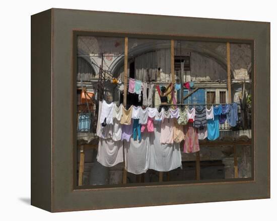 Large Quantity of Laundry Hanging from the Balcony of a Crumbling Building, Habana Vieja, Cuba-Eitan Simanor-Framed Premier Image Canvas