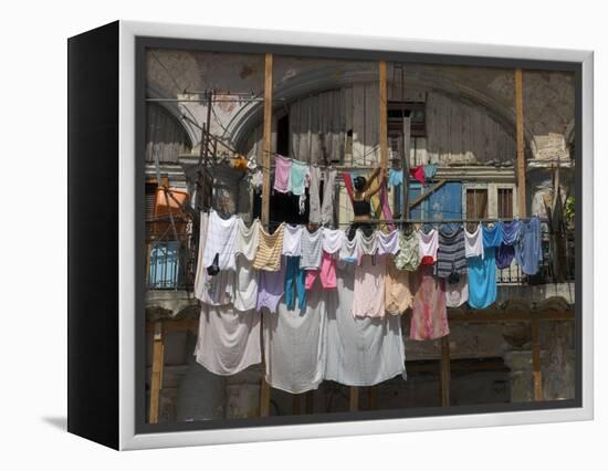 Large Quantity of Laundry Hanging from the Balcony of a Crumbling Building, Habana Vieja, Cuba-Eitan Simanor-Framed Premier Image Canvas