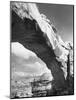 Large Rock Formation Forming a Bridge across Desert-Loomis Dean-Mounted Photographic Print