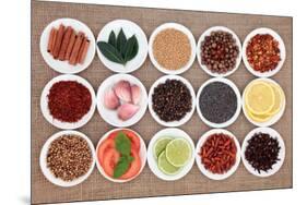 Large Spice, Herb And Food Ingredient Selection In White Porcelain Bowls Over Hessian Background-marilyna-Mounted Art Print
