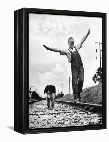 Larry Jim Holm with Dunk, His Spaniel Collie Mix, Walking Rail of Railroad Tracks in Rural Area-Myron Davis-Framed Premier Image Canvas