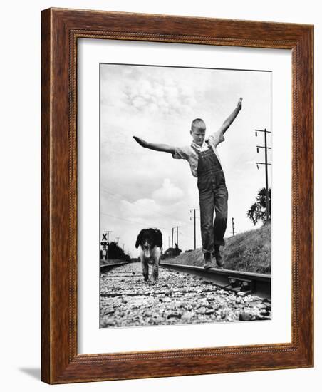 Larry Jim Holm with Dunk, His Spaniel Collie Mix, Walking Rail of Railroad Tracks in Rural Area-Myron Davis-Framed Photographic Print