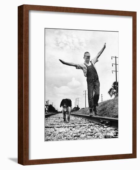 Larry Jim Holm with Dunk, His Spaniel Collie Mix, Walking Rail of Railroad Tracks in Rural Area-Myron Davis-Framed Photographic Print