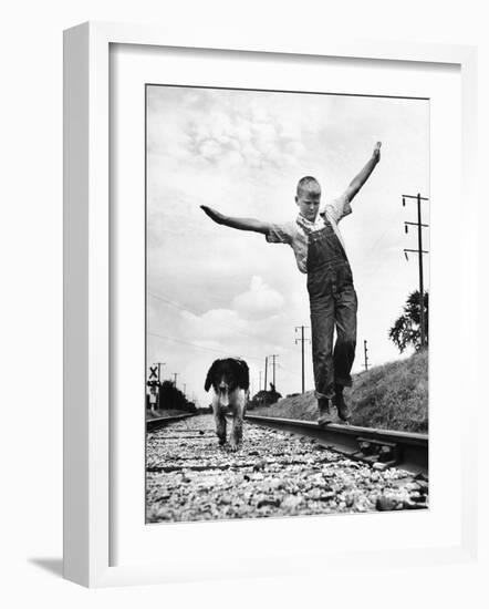 Larry Jim Holm with Dunk, His Spaniel Collie Mix, Walking Rail of Railroad Tracks in Rural Area-Myron Davis-Framed Photographic Print