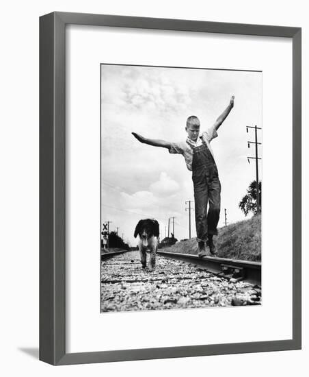 Larry Jim Holm with Dunk, His Spaniel Collie Mix, Walking Rail of Railroad Tracks in Rural Area-Myron Davis-Framed Photographic Print