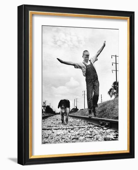 Larry Jim Holm with Dunk, His Spaniel Collie Mix, Walking Rail of Railroad Tracks in Rural Area-Myron Davis-Framed Photographic Print