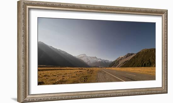 Late afternoon sun over a long straight road into the mountains, South Island, New Zealand, Pacific-Logan Brown-Framed Photographic Print