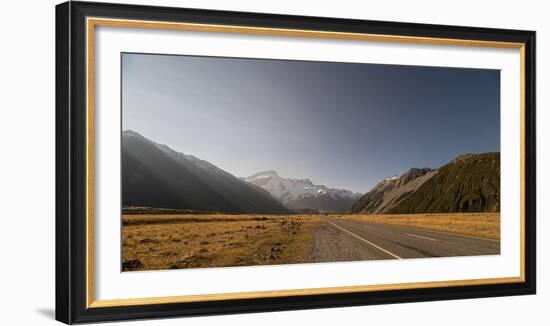 Late afternoon sun over a long straight road into the mountains, South Island, New Zealand, Pacific-Logan Brown-Framed Photographic Print