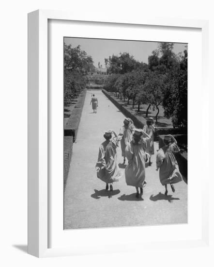 Late For Graduation, Five Seniors Holding on to Their Caps and Race to the Ceremony-Ed Clark-Framed Photographic Print