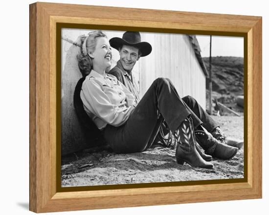 Laughing Couple in Western Attire Sitting on the Ground-null-Framed Stretched Canvas