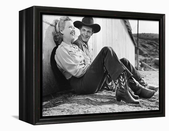 Laughing Couple in Western Attire Sitting on the Ground-null-Framed Stretched Canvas