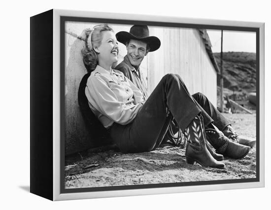 Laughing Couple in Western Attire Sitting on the Ground-null-Framed Stretched Canvas