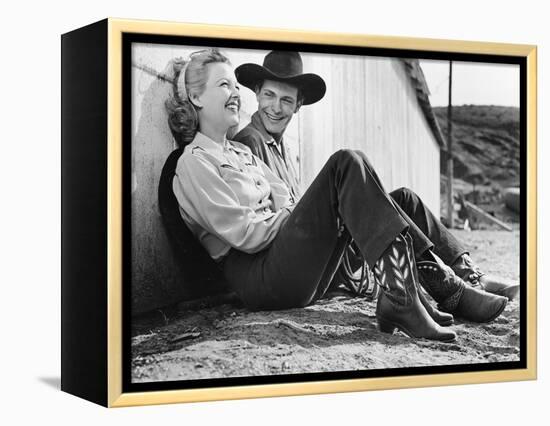 Laughing Couple in Western Attire Sitting on the Ground-null-Framed Stretched Canvas