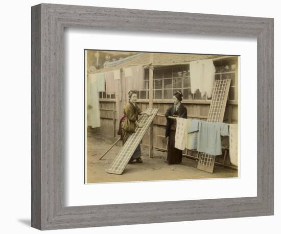 Laundry Day in Japan: Two Women Hang Up Clothes and Fabric to Dry Outdoors-null-Framed Photographic Print