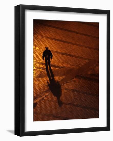 Law Enforcement Officer Patrols before the Opening Ceremony for the Vancouver 2010 Olympics-null-Framed Photographic Print