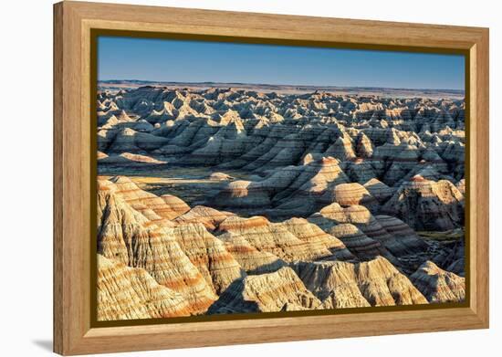 Layers of hoodoo peaks stretching into a flat landscape at the horizon.-Sheila Haddad-Framed Premier Image Canvas