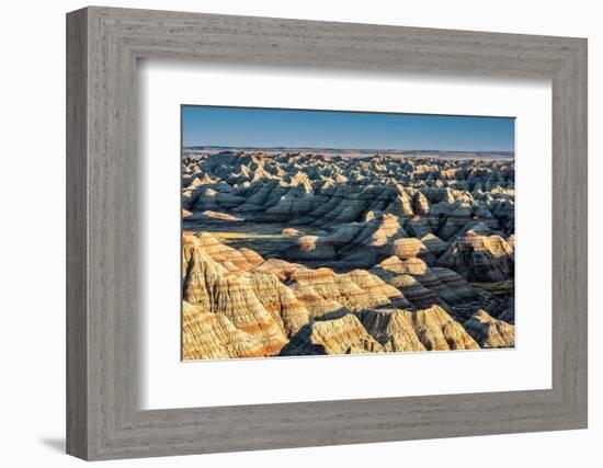 Layers of hoodoo peaks stretching into a flat landscape at the horizon.-Sheila Haddad-Framed Photographic Print