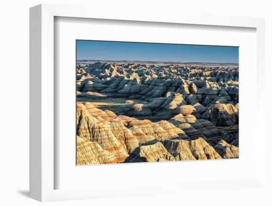 Layers of hoodoo peaks stretching into a flat landscape at the horizon.-Sheila Haddad-Framed Photographic Print