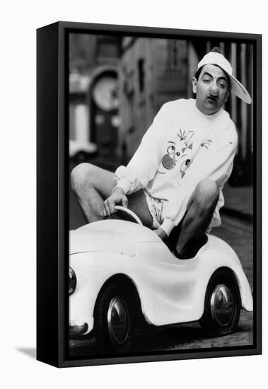 Le Comedien Britannique Rowan Atkinson Portant Un Nez De Clown Dans Une Voiture Pour Enfants-null-Framed Stretched Canvas