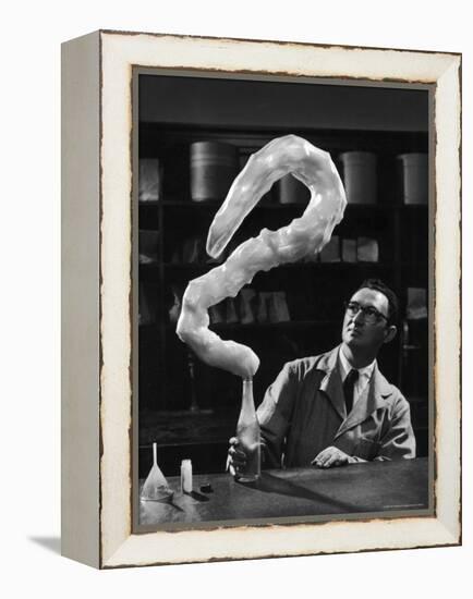 Leaping Rubber Explosively from Butadiene Gas in Bottle as Demonstrated by M.I.T.'s Dr. A. Morton-W^ Eugene Smith-Framed Premier Image Canvas