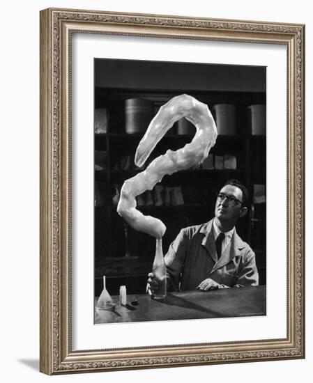 Leaping Rubber Explosively from Butadiene Gas in Bottle as Demonstrated by M.I.T.'s Dr. A. Morton-W^ Eugene Smith-Framed Photographic Print