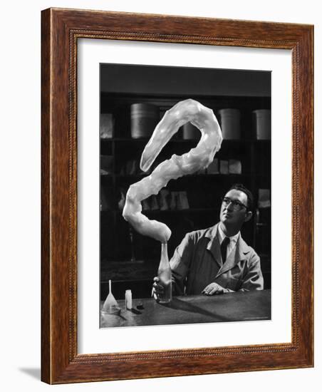 Leaping Rubber Explosively from Butadiene Gas in Bottle as Demonstrated by M.I.T.'s Dr. A. Morton-W^ Eugene Smith-Framed Photographic Print