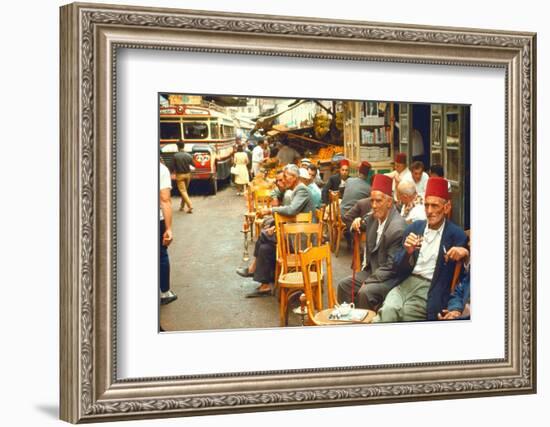 Lebanese Gentlemen sits at a steetside cafe sipping tea and smoking traditional narghile pipes-Carlo Bavagnoli-Framed Photographic Print