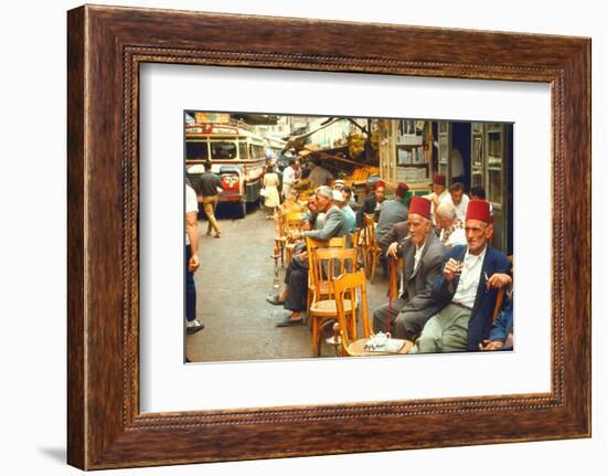 Lebanese Gentlemen sits at a steetside cafe sipping tea and smoking traditional narghile pipes-Carlo Bavagnoli-Framed Photographic Print