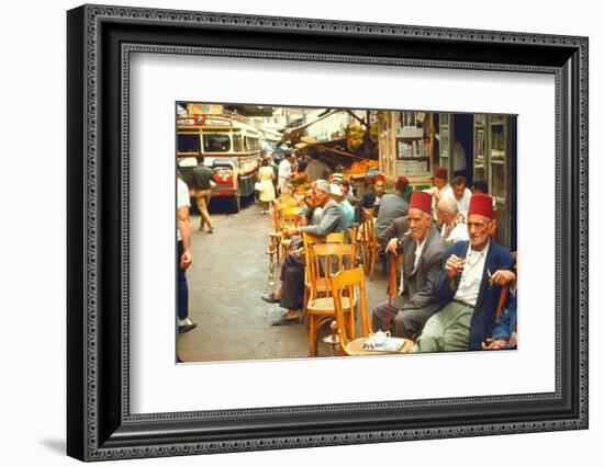 Lebanese Gentlemen sits at a steetside cafe sipping tea and smoking traditional narghile pipes-Carlo Bavagnoli-Framed Photographic Print