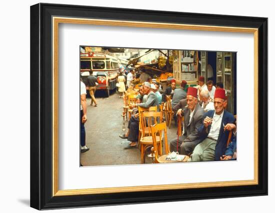 Lebanese Gentlemen sits at a steetside cafe sipping tea and smoking traditional narghile pipes-Carlo Bavagnoli-Framed Photographic Print