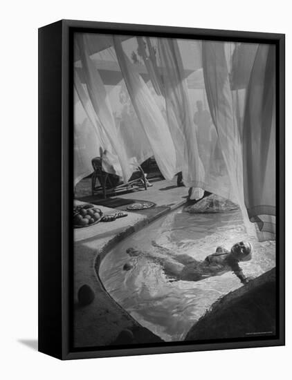 Lee Anderson Swimming Into Living Room of Raymond Loewy's House-Peter Stackpole-Framed Premier Image Canvas