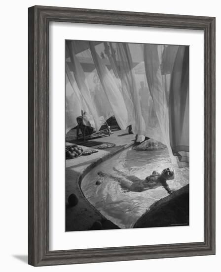 Lee Anderson Swimming Into Living Room of Raymond Loewy's House-Peter Stackpole-Framed Photographic Print