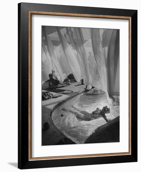 Lee Anderson Swimming Into Living Room of Raymond Loewy's House-Peter Stackpole-Framed Photographic Print