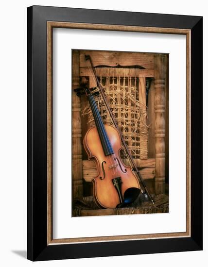 Left Handled Violin Lying on an Old and Ruined Chair-AGCuesta-Framed Photographic Print