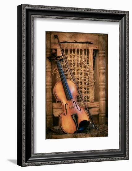 Left Handled Violin Lying on an Old and Ruined Chair-AGCuesta-Framed Photographic Print